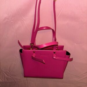 Pink Crossbody Bag with Structured Design and Versatile Straps